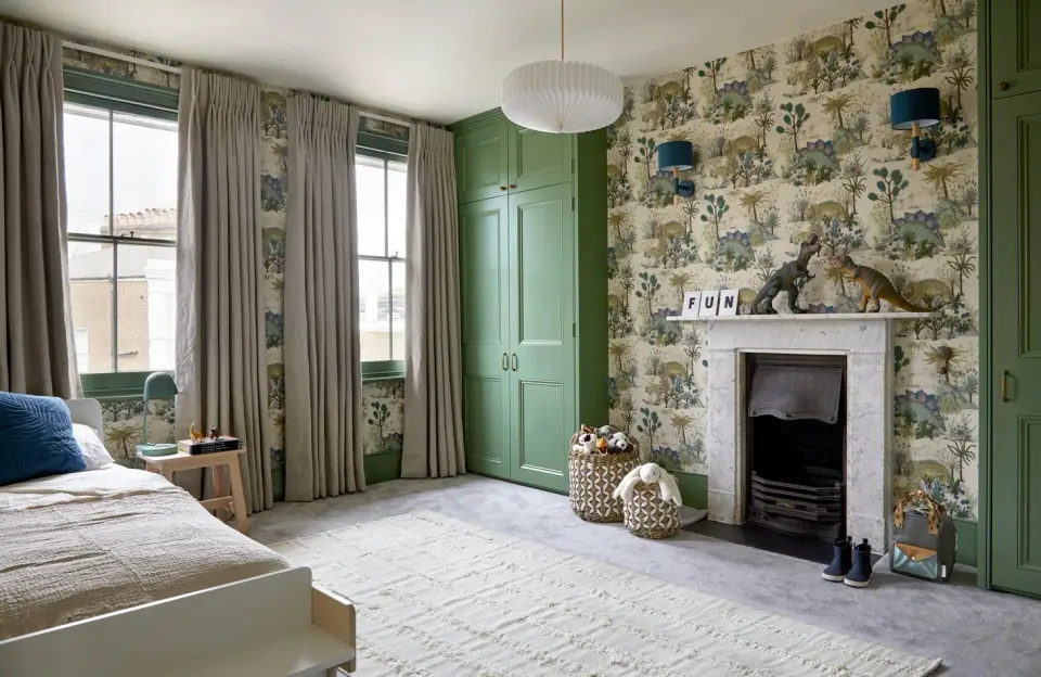Dartmouth Park townhouse living room with green panelled door, botanical wallpaper and period fireplace