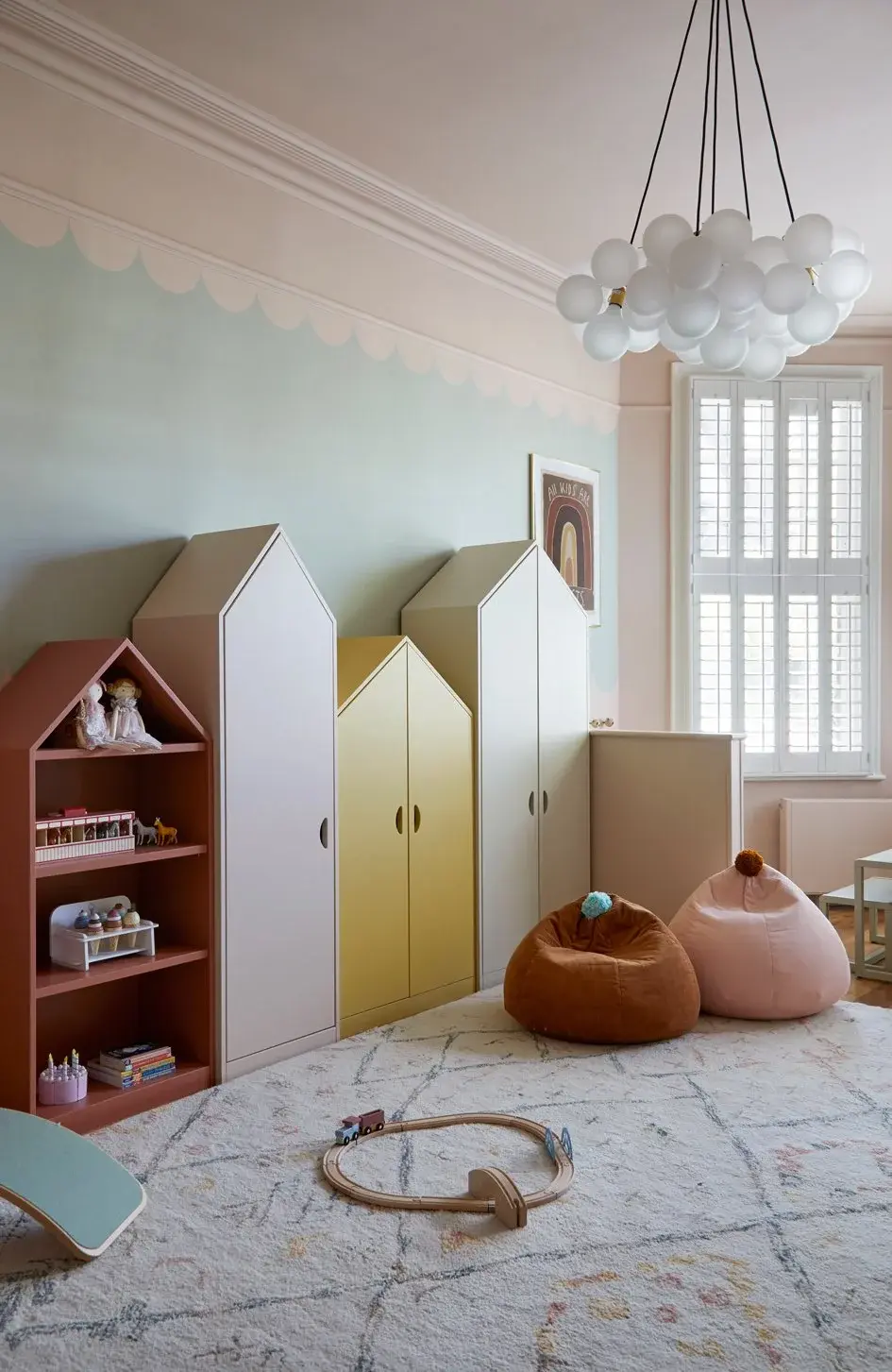 Child’s bedroom with playful house-shaped wardrobes