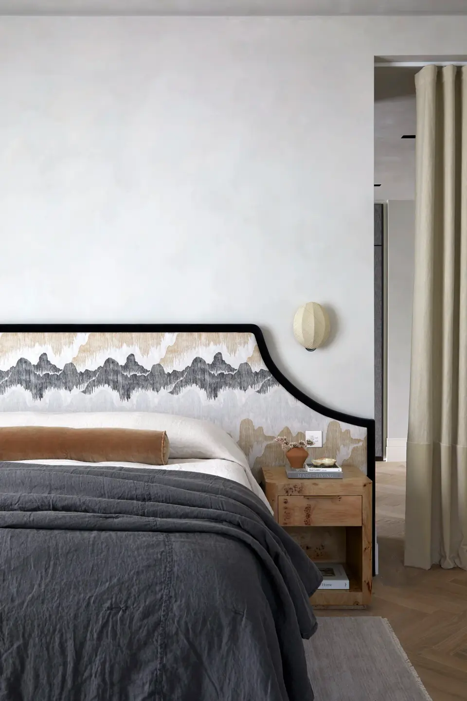 Bedroom at The Whiteley with a sculpted headboard wall
